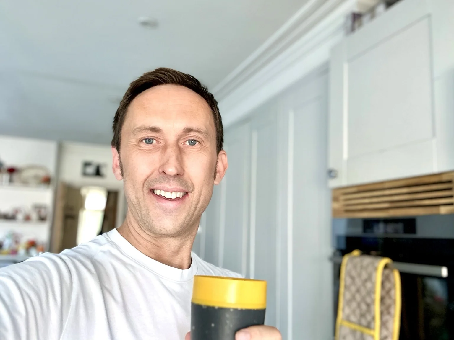 Dave Williams smiling in a kitchen